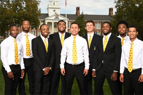 Diverse group of young men standing in front of Bunce Hall