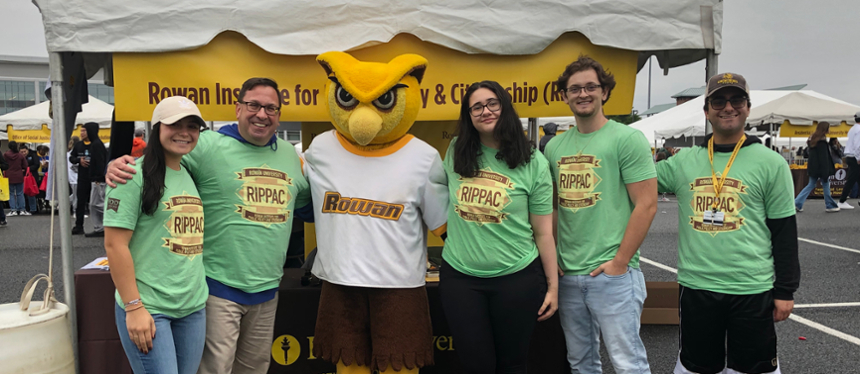 Dr. Dworkin and students at RIPPAC table Homecoming 2023