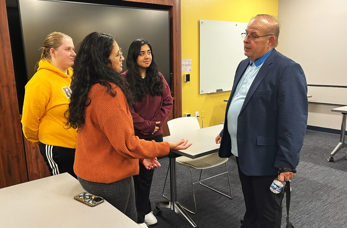 Judge Julio Mendez speaks with students