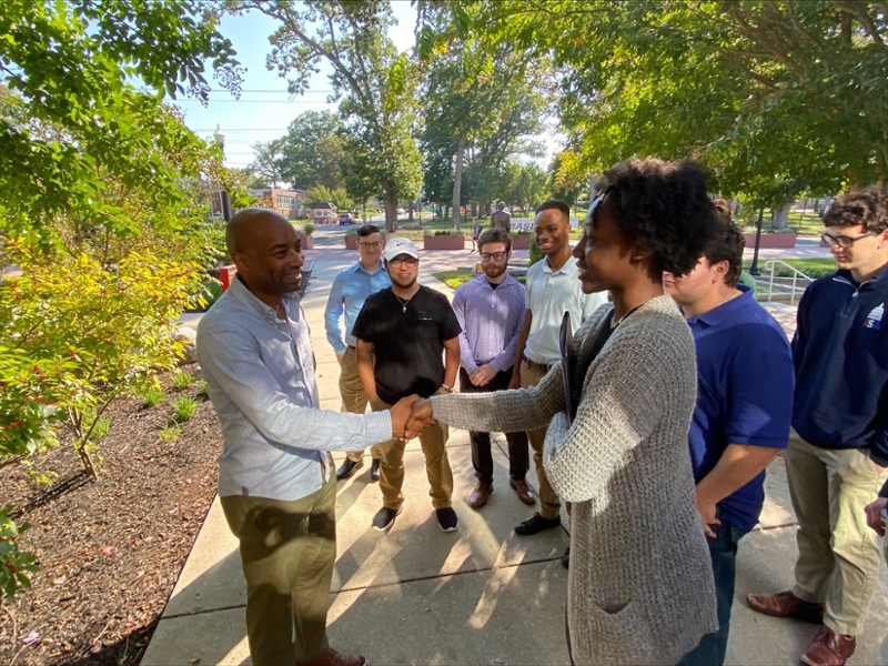 Mo Butler greeting students at Late Lunch